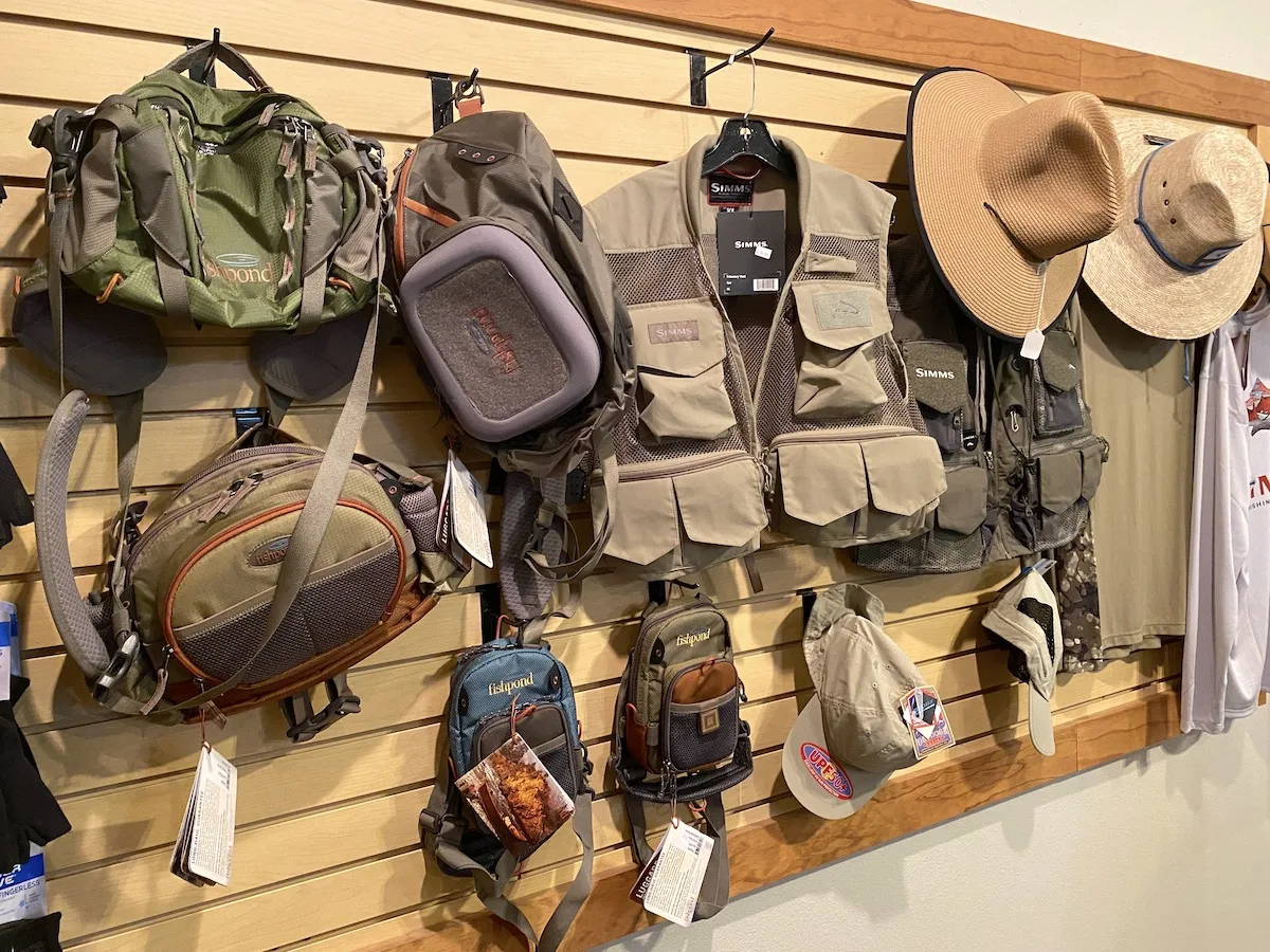 Fly fishing hats and vests in a fly fishing shop