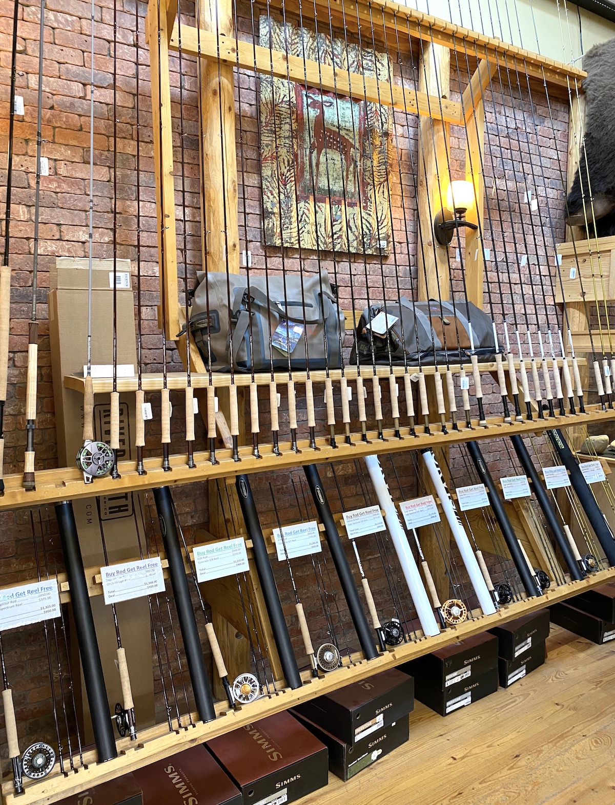 Fly rods in a standing rack at a fly rod shop