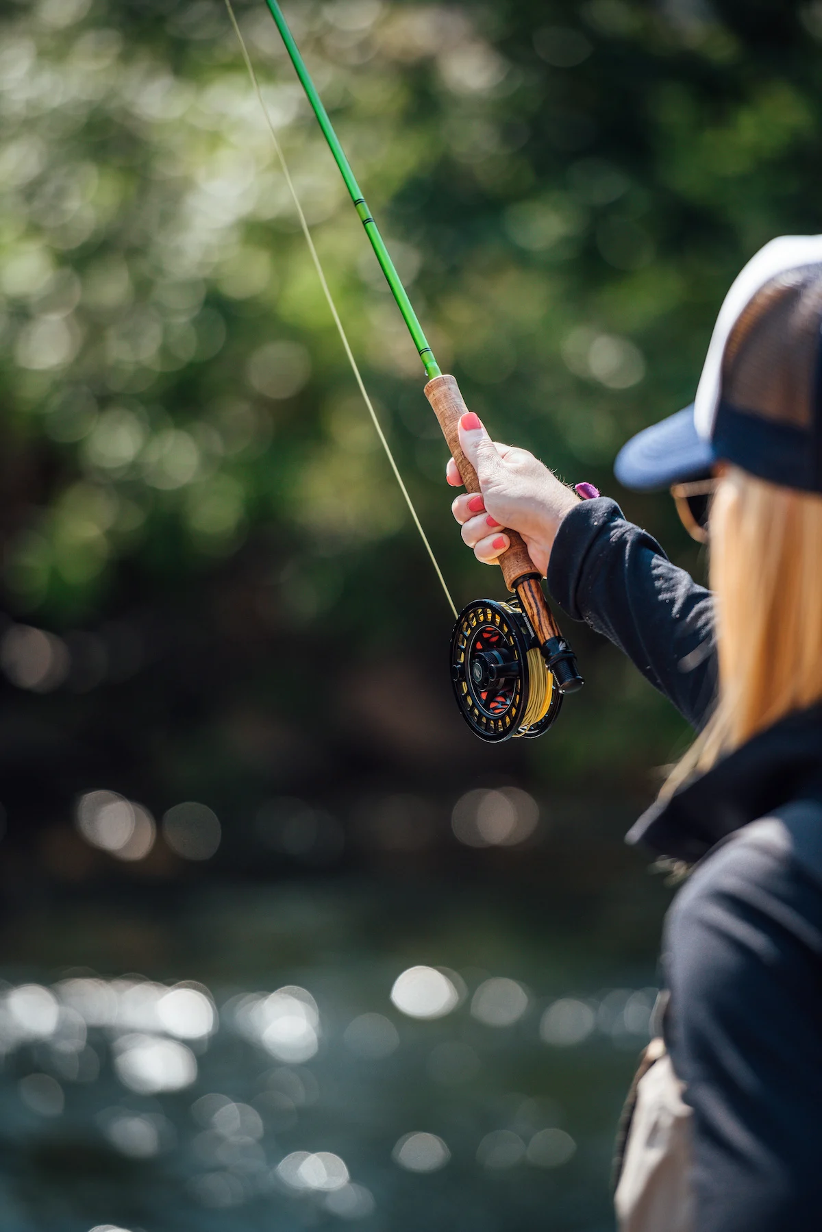 Woman-casting-a-fly-fishing-rod