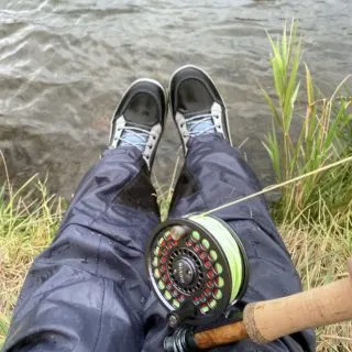Boots, waders, and a fishing rod and reel