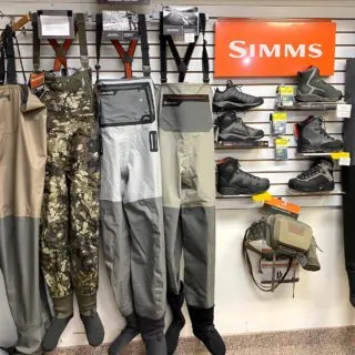 Fly fishing store display of fishing waders and wading boots